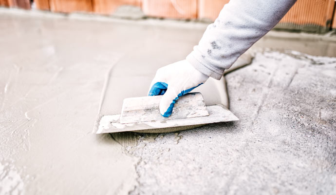 Person renovating basement with equipment