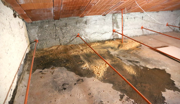 basement with water leakage and copper pipes