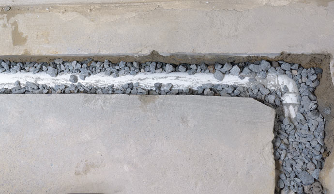 Installing drainage system on concrete floor