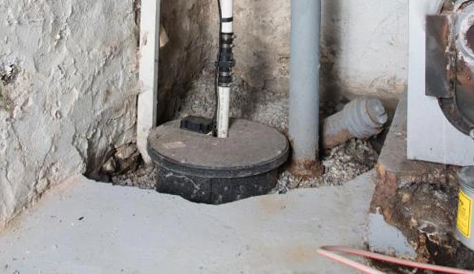 Sump pump installed in basement corner