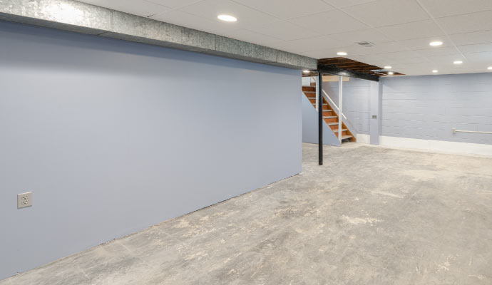 An unfinished basement with exposed wooden beams